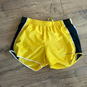 Nike yellow and black livestrong shorts! Size small